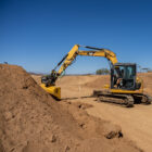 Excavator Tilting Bucket Digging Dirt - Rockland Manufacturing